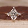 Three Stone Engagement Ring with Dutch marquise center diamond.
