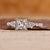 Princess cut diamond engagement ring with pave setting ring.
