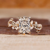Nature inspired radiant diamond ring with leaf-style prongs.
