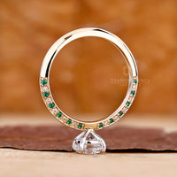 Green diamond eternity ring with modern dual tone band.
