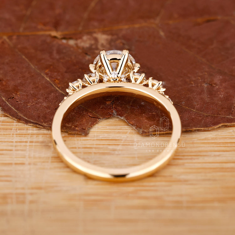 IGI certified diamond with round side stones.
