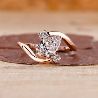 Three stone diamond ring in rose gold.
