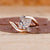 Three stone diamond ring in rose gold.
