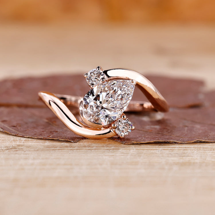 Three stone diamond ring in rose gold.
