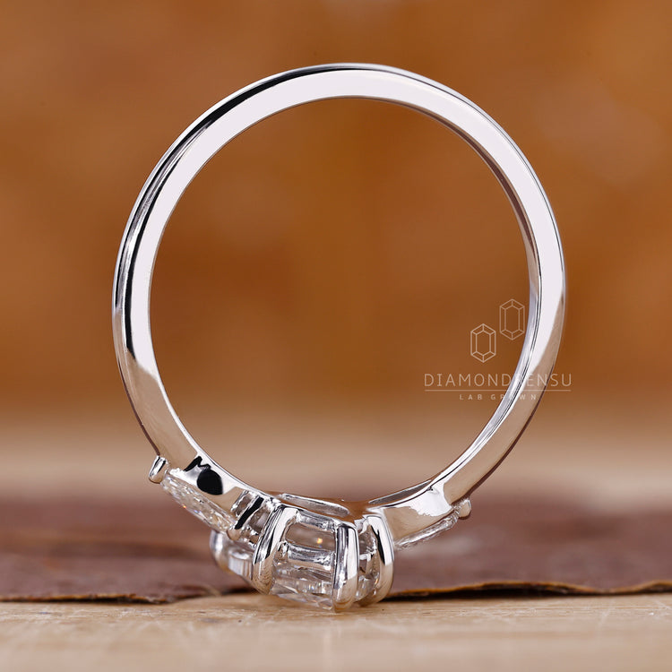Buy Engagement ring with pear side stones.
