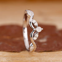 Vintage Wedding Band with moon birthstone and cluster layout.
