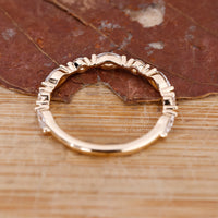 Marquise shape diamond band in gold.
