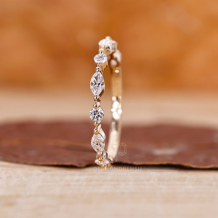 Marquise and round diamond half eternity band.
