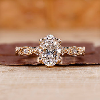 Oval shaped engagement ring with art deco ring.
