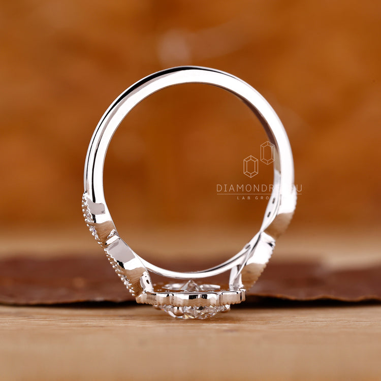 4 Prong Ring holding a round cut lab grown diamond.
