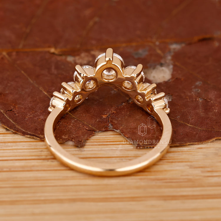 Yellow Gold Diamond Band with seven round cut diamonds.
