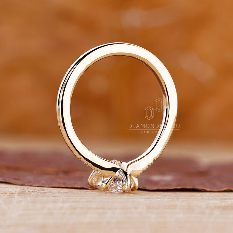 Buy Engagement ring with round side stone.
