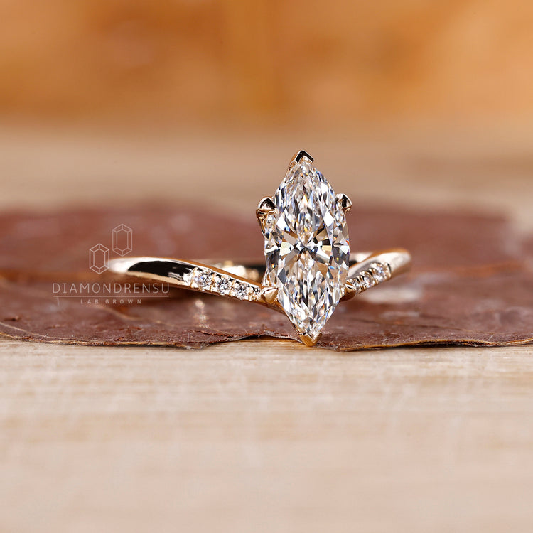 Tapered shank band used in marquise engagement ring.

