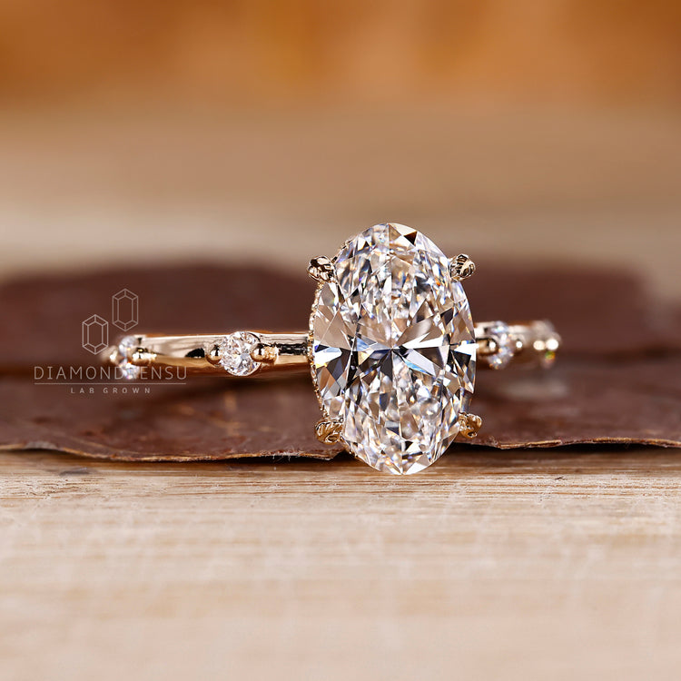 Custom Engagement Ring with gold oval center and pave details.
