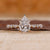 Pear shaped engagement ring with hidden halo.
