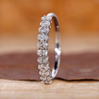 Oval diamond wedding band in white gold.