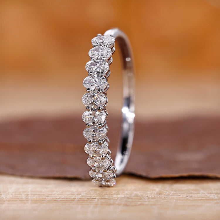 Oval diamond wedding band in white gold.