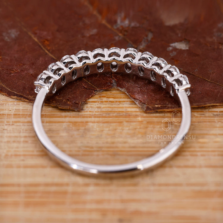 Diamond stacking band in half eternity style.