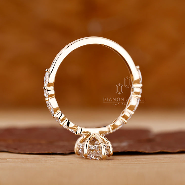 Unique marquise and round side stone ring.
