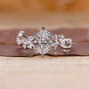Oval diamond engagement ring with vine engagement ring.
