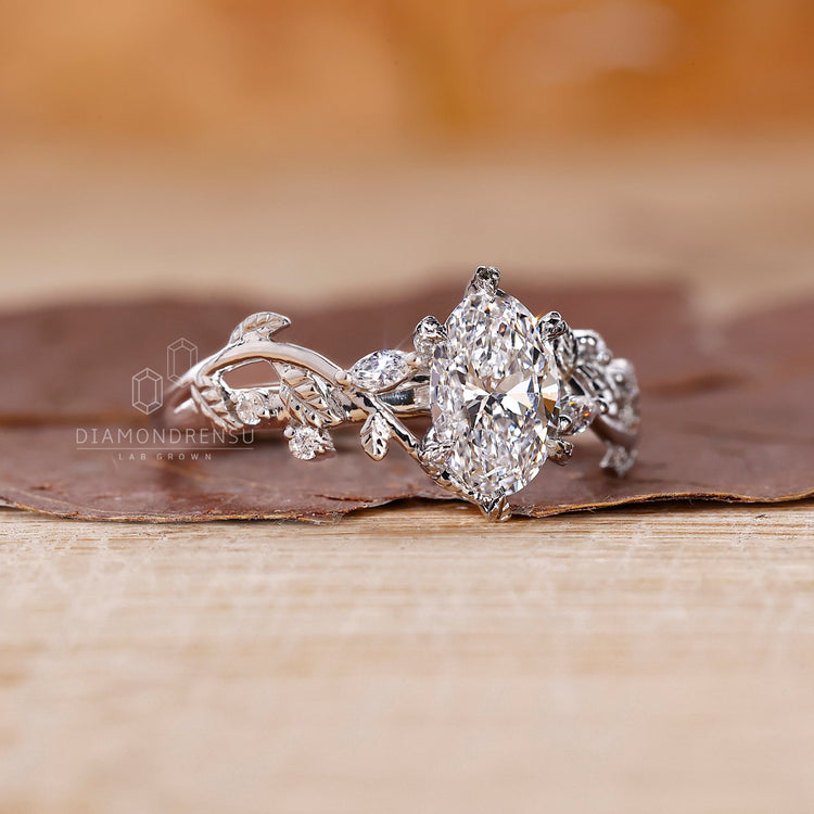 Vine engagement ring made with marquise and round side stone.

