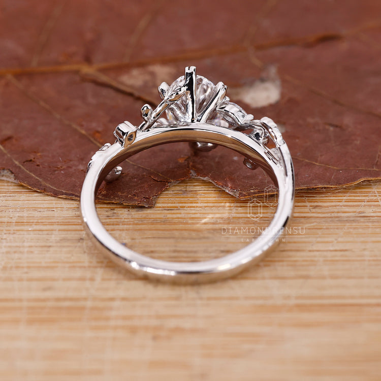 Lab Grown Diamond used in marquise and round side stone.
