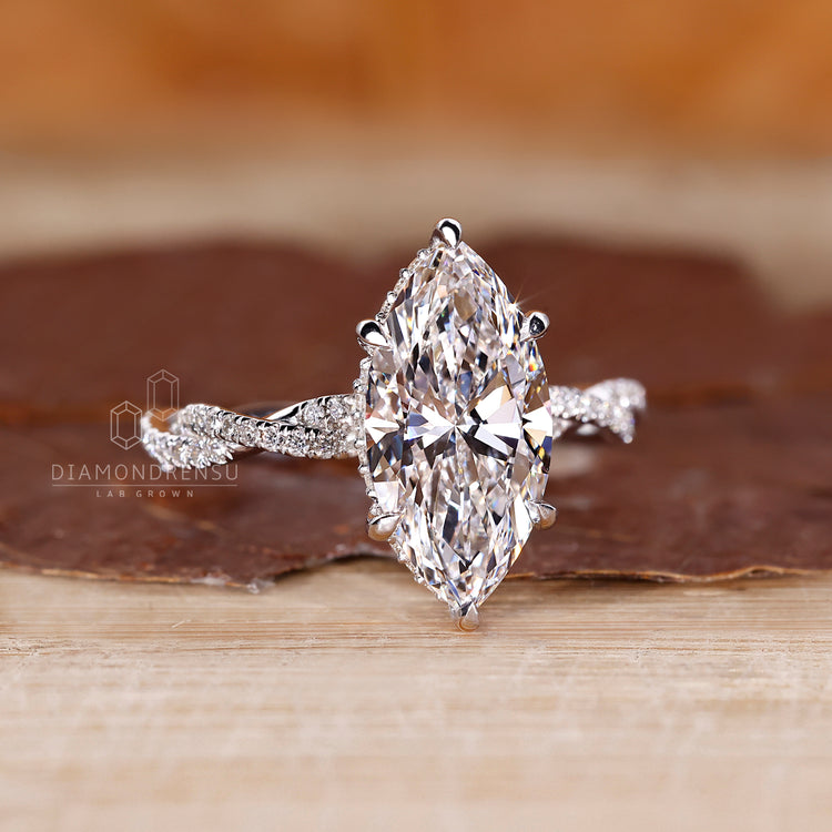 Marquise and Round Diamond Ring in a twisted pave design.
