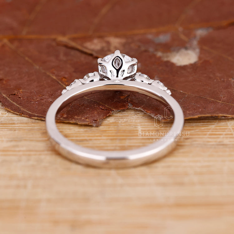Custom diamond ring with unique tapered shank and 6 prong setting.
