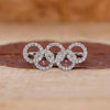 Round diamond engagement ring with Diamond Olympic Ring.
