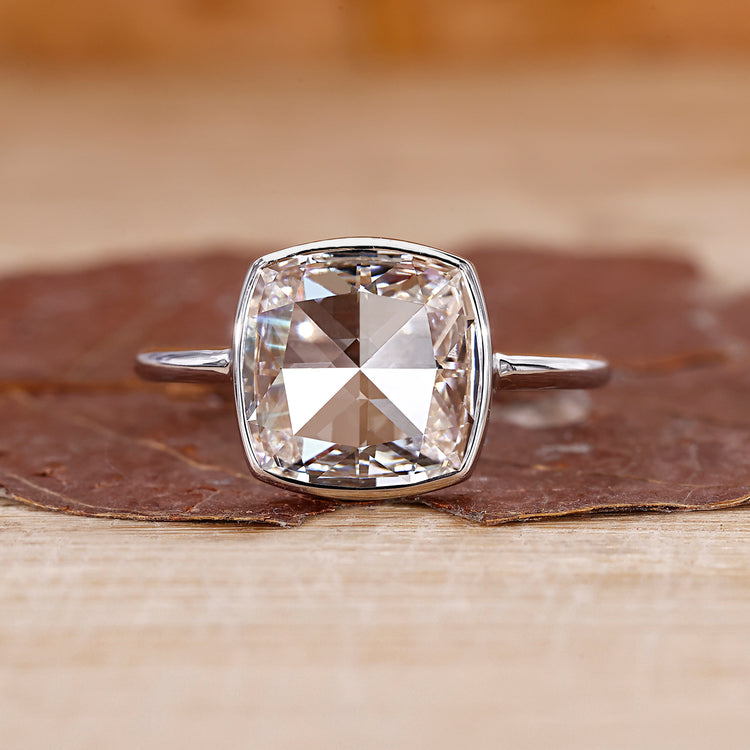 Bezel set diamond ring with cushion rose cut engagement ring.
