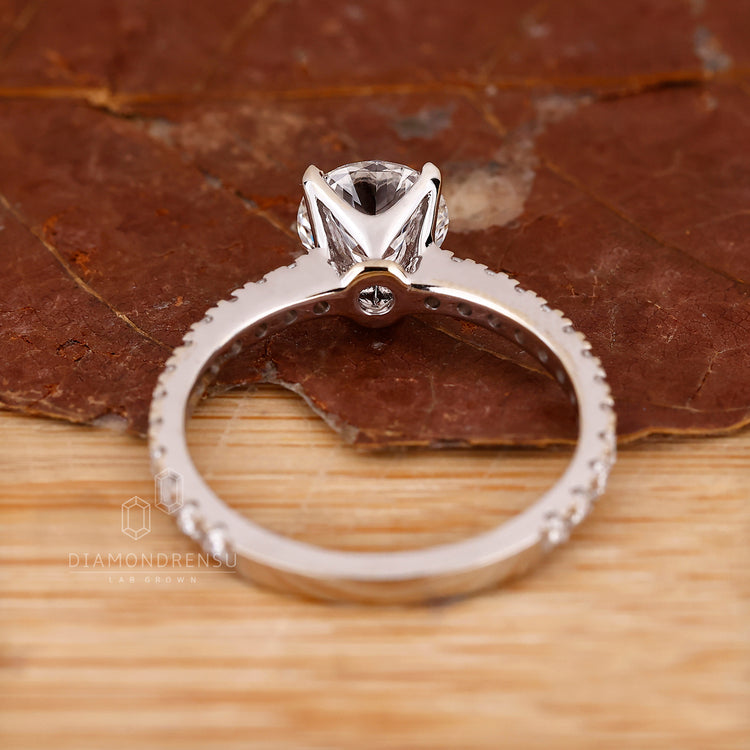 Lab grown round diamond pave engagement ring.
