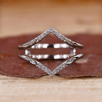 V Shape Wedding Band with round diamonds in prong setting.
