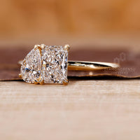 Pear and radiant diamond ring set in handmade ring.
