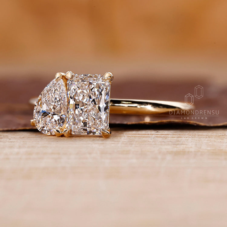 Pear and radiant diamond ring set in handmade ring.
