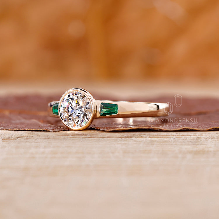 Yellow gold engagement ring with 3 stone ring.
