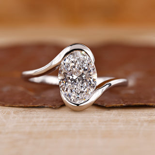 Oval cut diamond ring with bypass setting.
