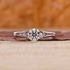 Split shank engagement ring with round cut diamond centre.
