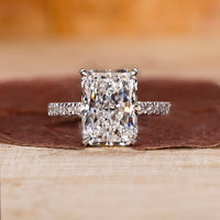 Radiant cut engagement ring with pave setting.
