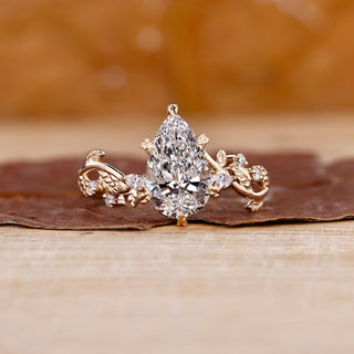 Pear shaped engagement ring in yellow gold diamond ring.
