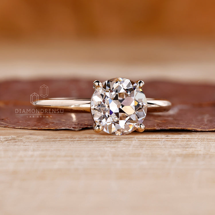 Lab grown round old cut ring solitaire four prong set.
