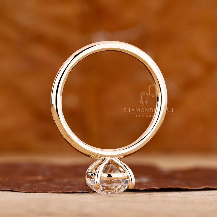 IGI certified round old cut ring four prong setting.