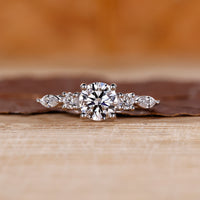 Round and Marquise Diamond Ring with tapered shank band.
