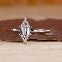 Solitaire engagement ring made with v prong setting.
