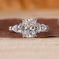 Cushion cut engagement ring with pave setting ring.
