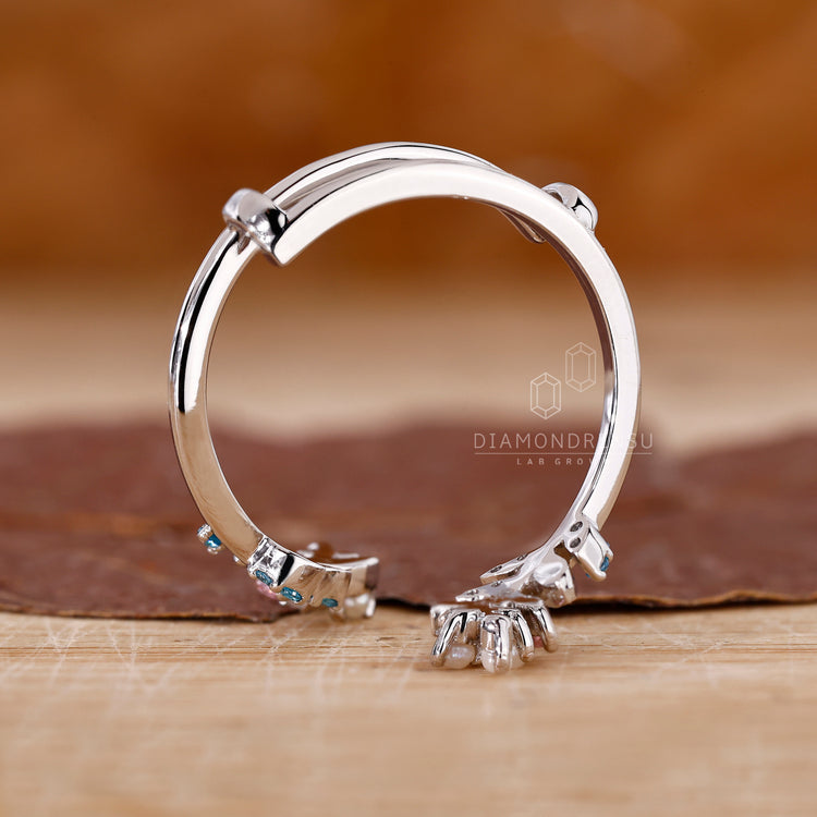 Gemstone wedding band with colorful accents.
