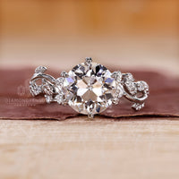 Nature inspired engagement ring made with side stones.
