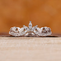 Marquise and round wedding band with white gold band.
