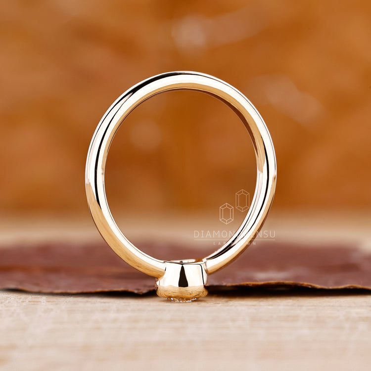Elegant bezel setting ring featuring lab grown diamond.
