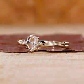 Oval rose cut engagement ring with 3 stone diamond ring.
