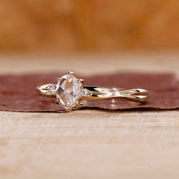 Oval rose cut engagement ring with 3 stone diamond ring.
